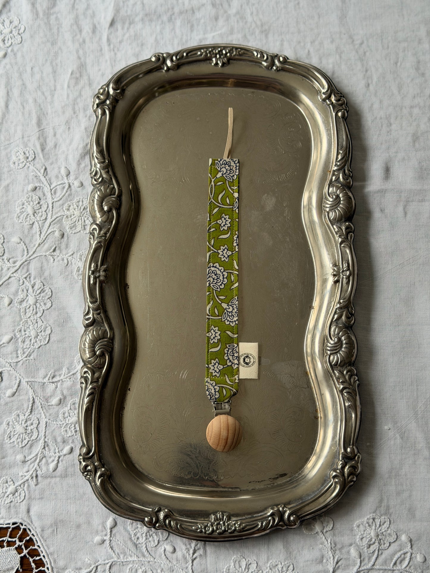 Attache-suce verte à motifs