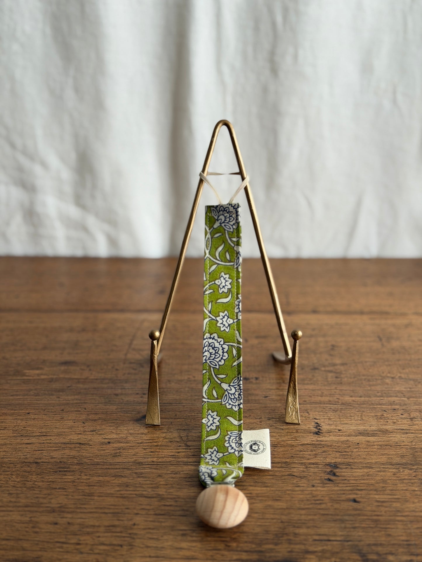 Attache-suce verte à motifs